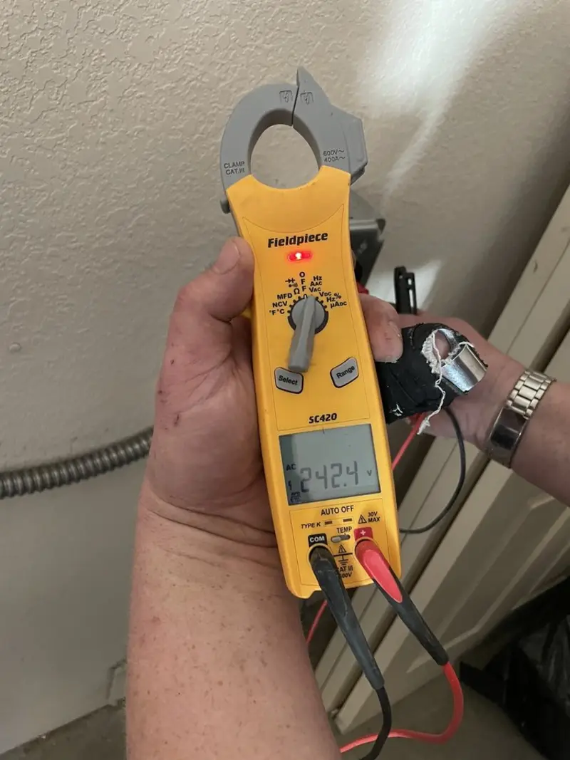Voltage testing with clamp meter during Electrical Installation Services in Marion Oaks
